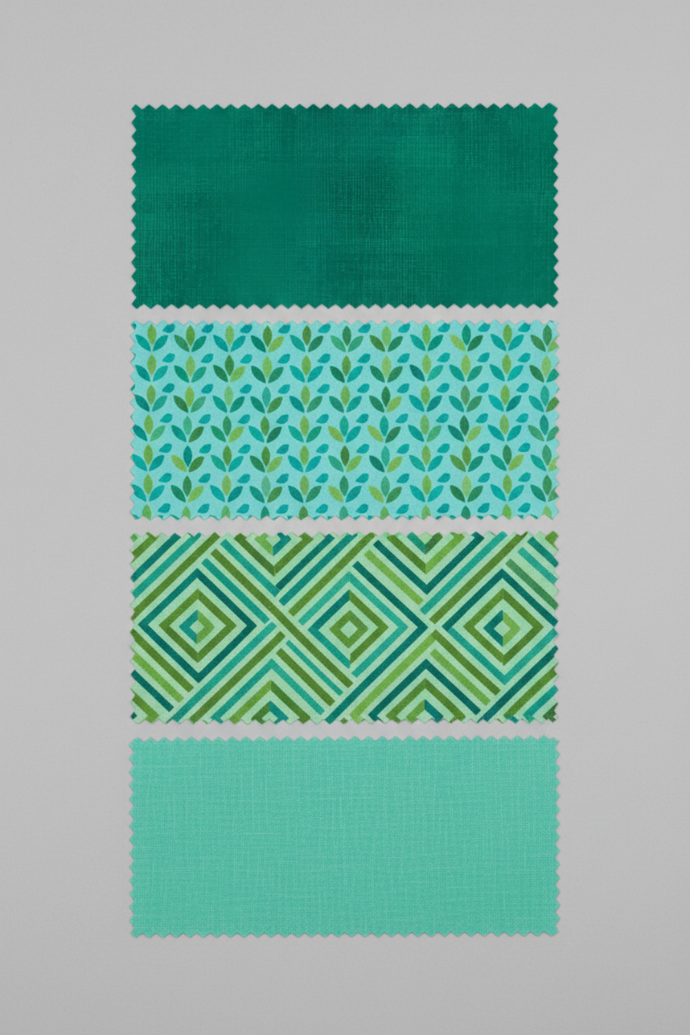 Interwoven Blue Green quilting cotton with three coordinating fabrics showing color palette and design inspiration