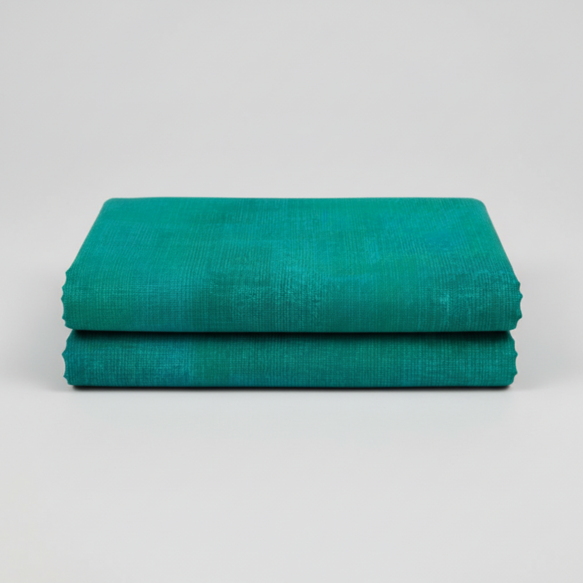 Interwoven Emerald quilting cotton showing fabric texture and geometric pattern detail