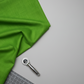 Interwoven Green quilting cotton lifestyle photo showing draped fabric on table surface with cutting mat and rotary cutter