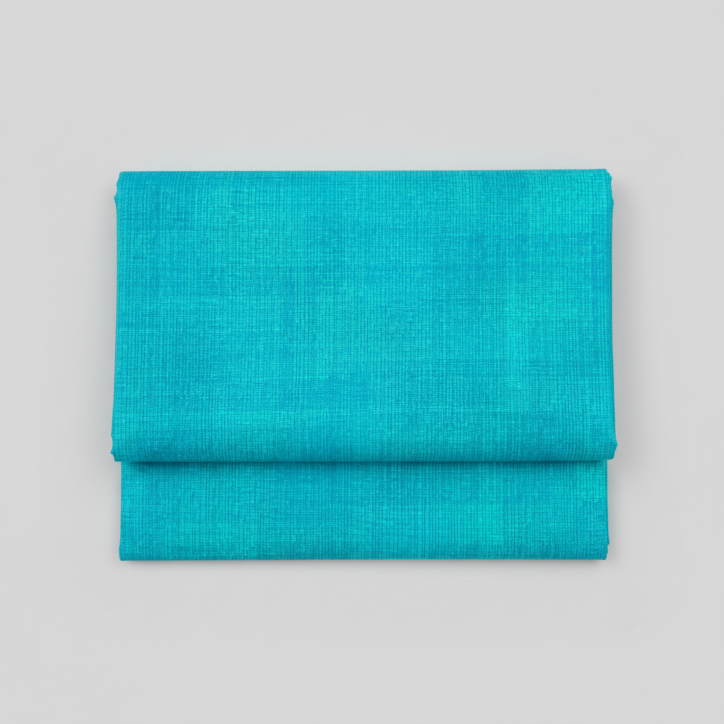 Interwoven Turquoise quilting cotton showing fabric texture and geometric pattern detail