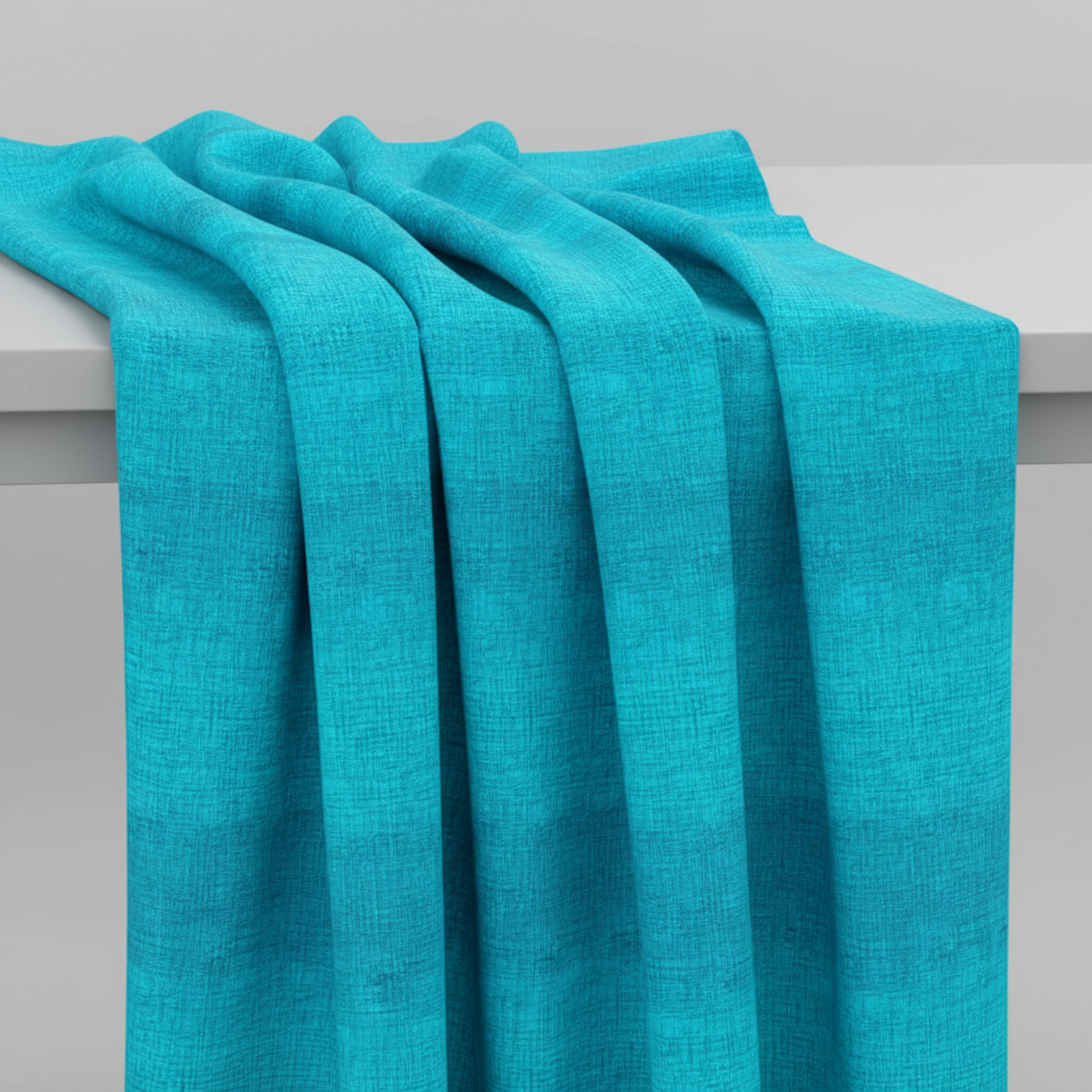 Interwoven Turquoise quilting cotton showing fabric body and drape quality