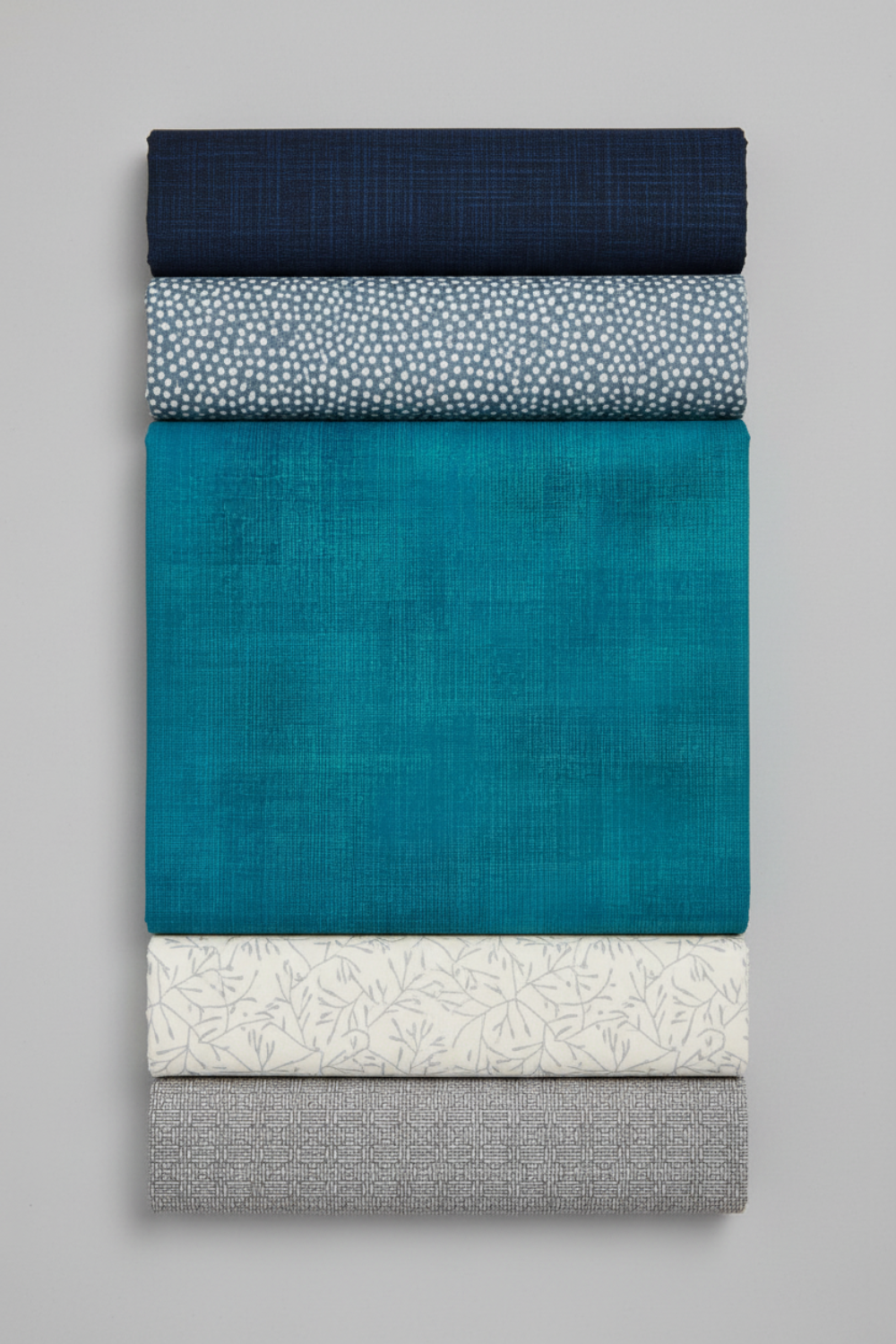 Interwoven Teal quilting cotton with four coordinating fabrics lifestyle photo showing color palette and design inspiration