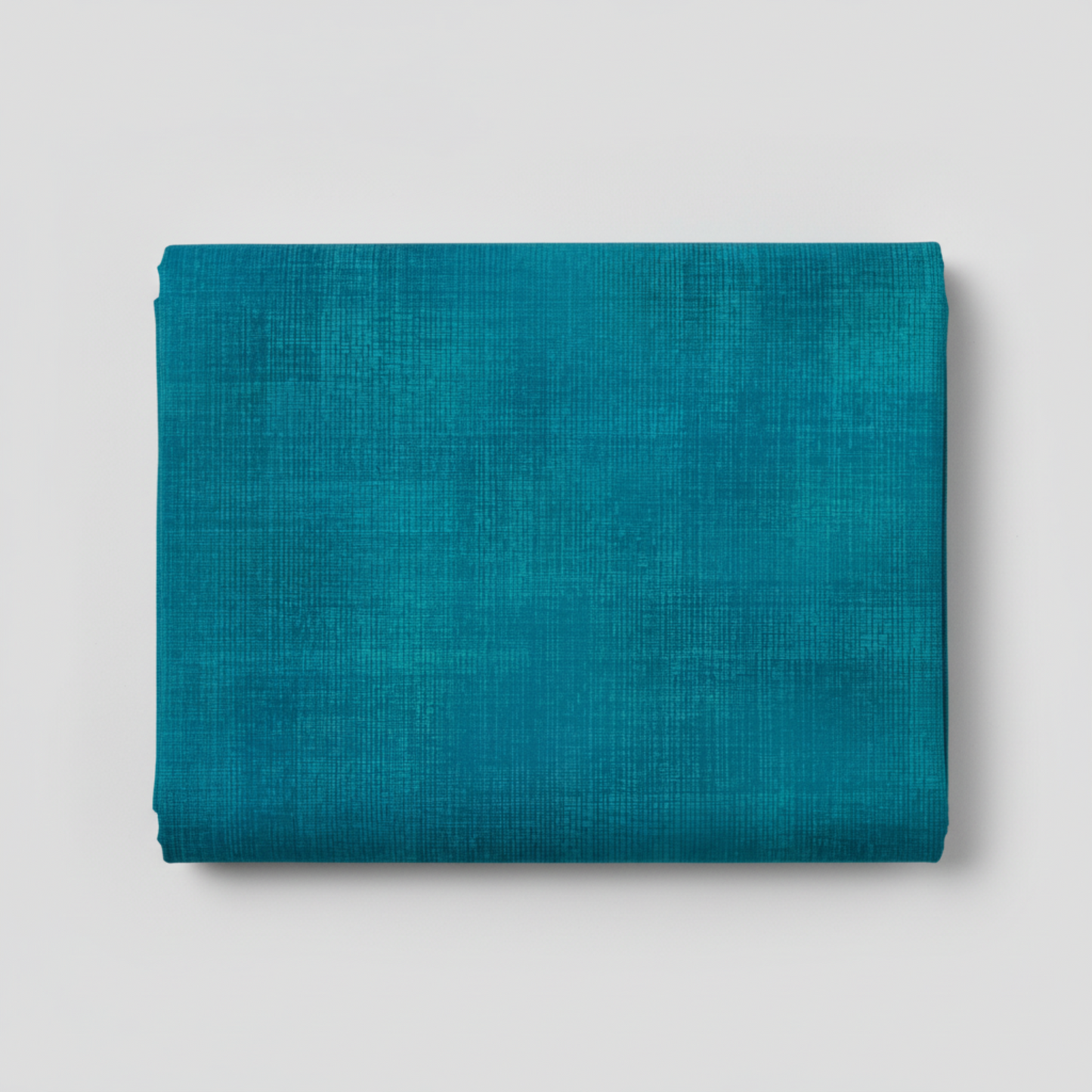 Interwoven Teal quilting cotton showing fabric texture and geometric pattern detail