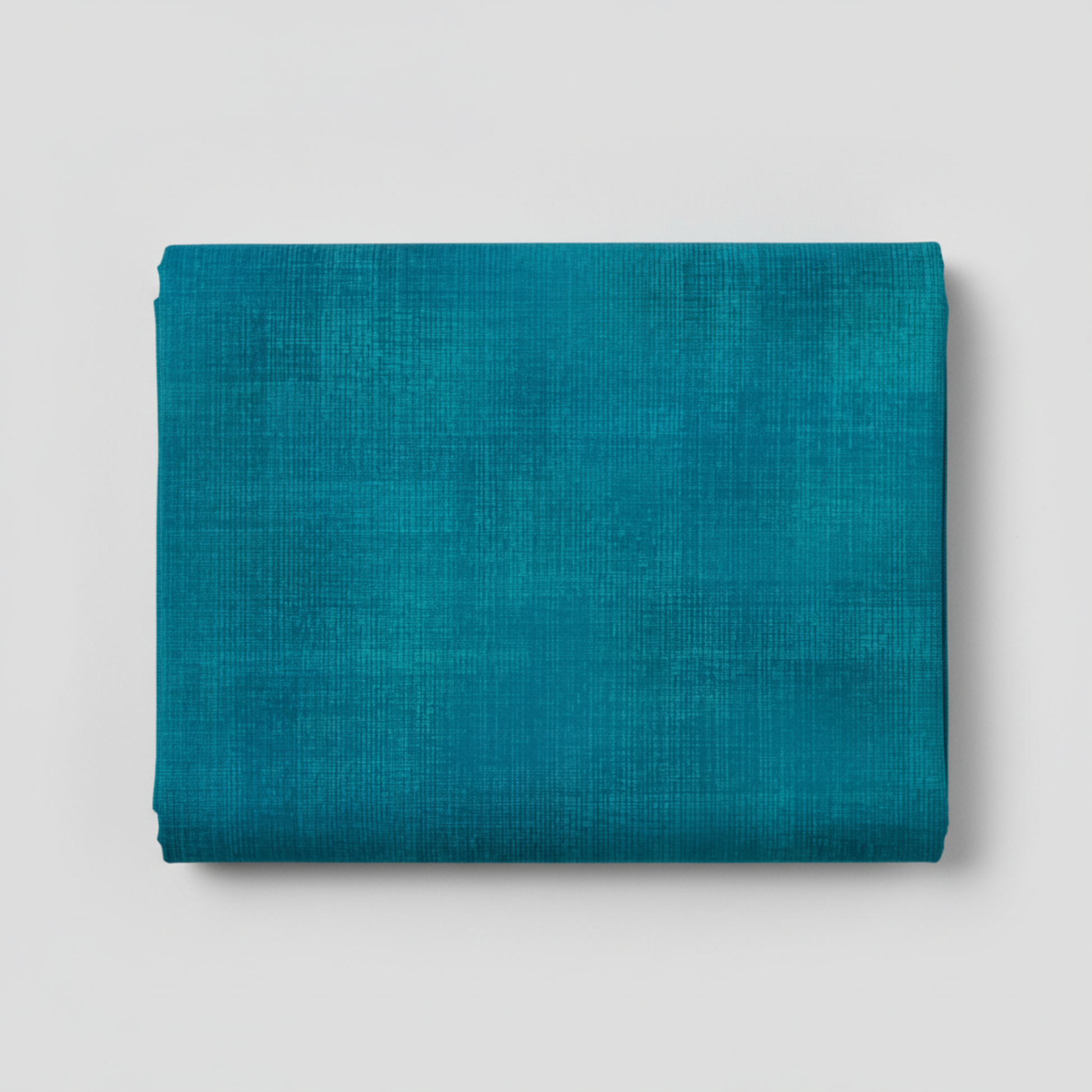 Interwoven Teal quilting cotton showing fabric texture and geometric pattern detail