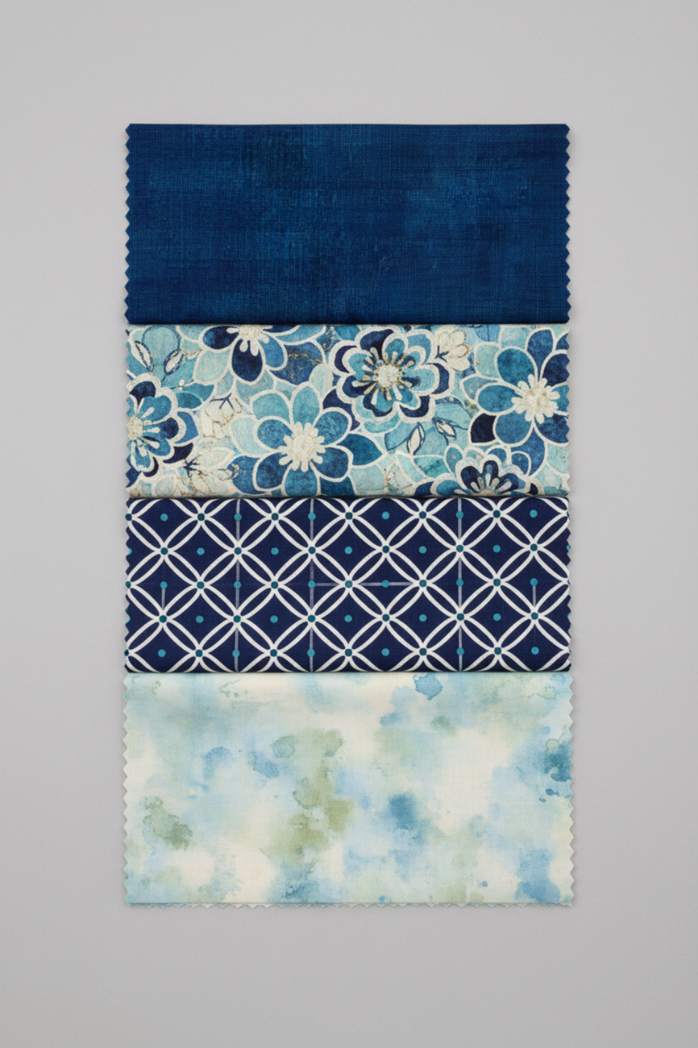 Interwoven Indigo quilting cotton with three coordinating fabrics lifestyle photo showing color palette and design inspiration
