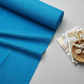 Interwoven Ocean quilting cotton showing fabric body and drape quality