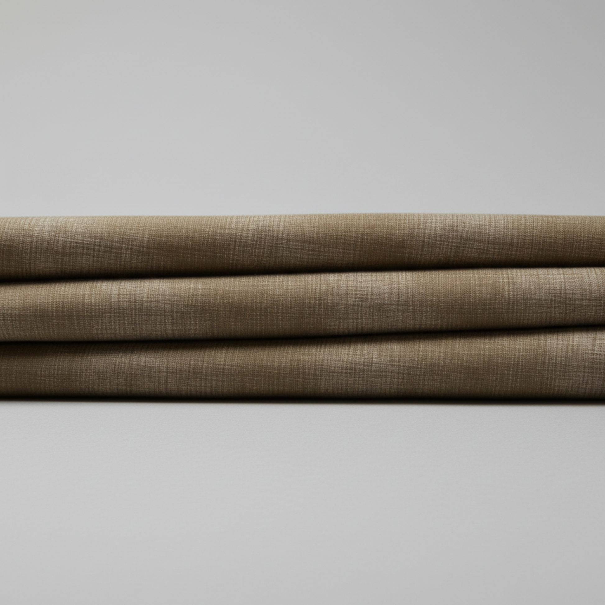 Interwoven Olive quilting cotton showing fabric texture and geometric pattern detail