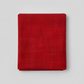Interwoven Red quilting cotton detail showing intersecting lines and warm red tones in geometric woven pattern