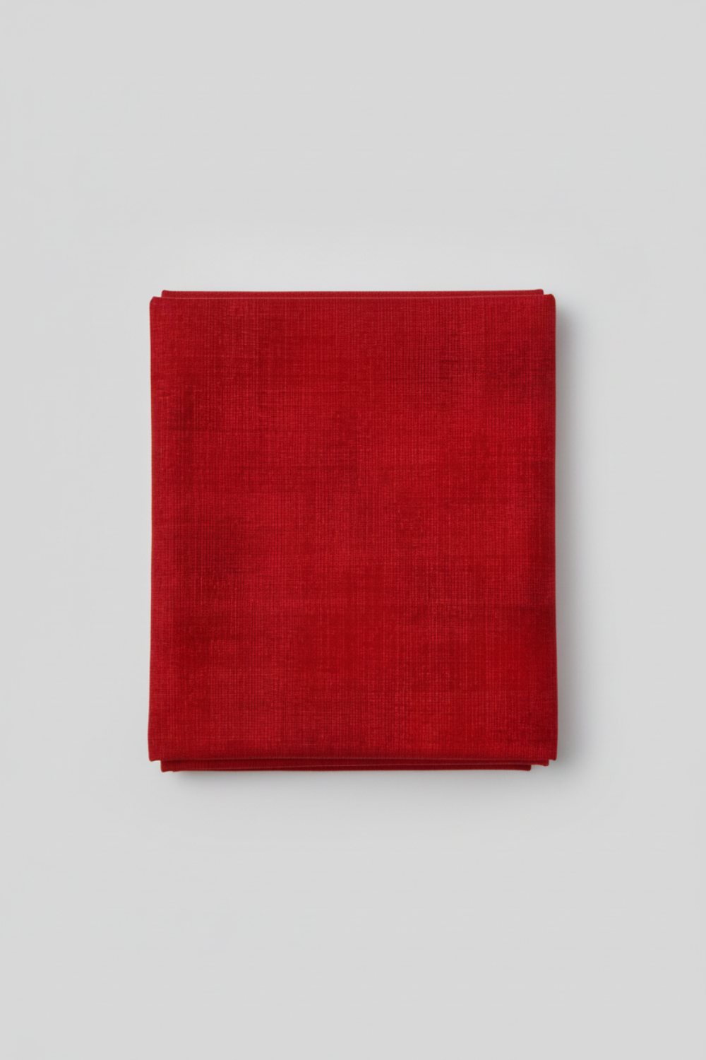 Interwoven Red quilting cotton detail showing intersecting lines and warm red tones in geometric woven pattern