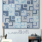 Blue Labyrinth quilt pattern by Zen Chic — stunning modern quarter log cabin in navy, blue and white interlocking squares creating a mesmerizing labyrinth illusion! Shop at IraRobi Quilts! #QuiltPattern #ZenChic #LogCabin #ModernQuilt #BlueAndWhite