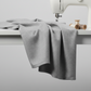 Interwoven Pewter by Jason Yenter – fabric draped from sewing machine down to table, showing softness and body
