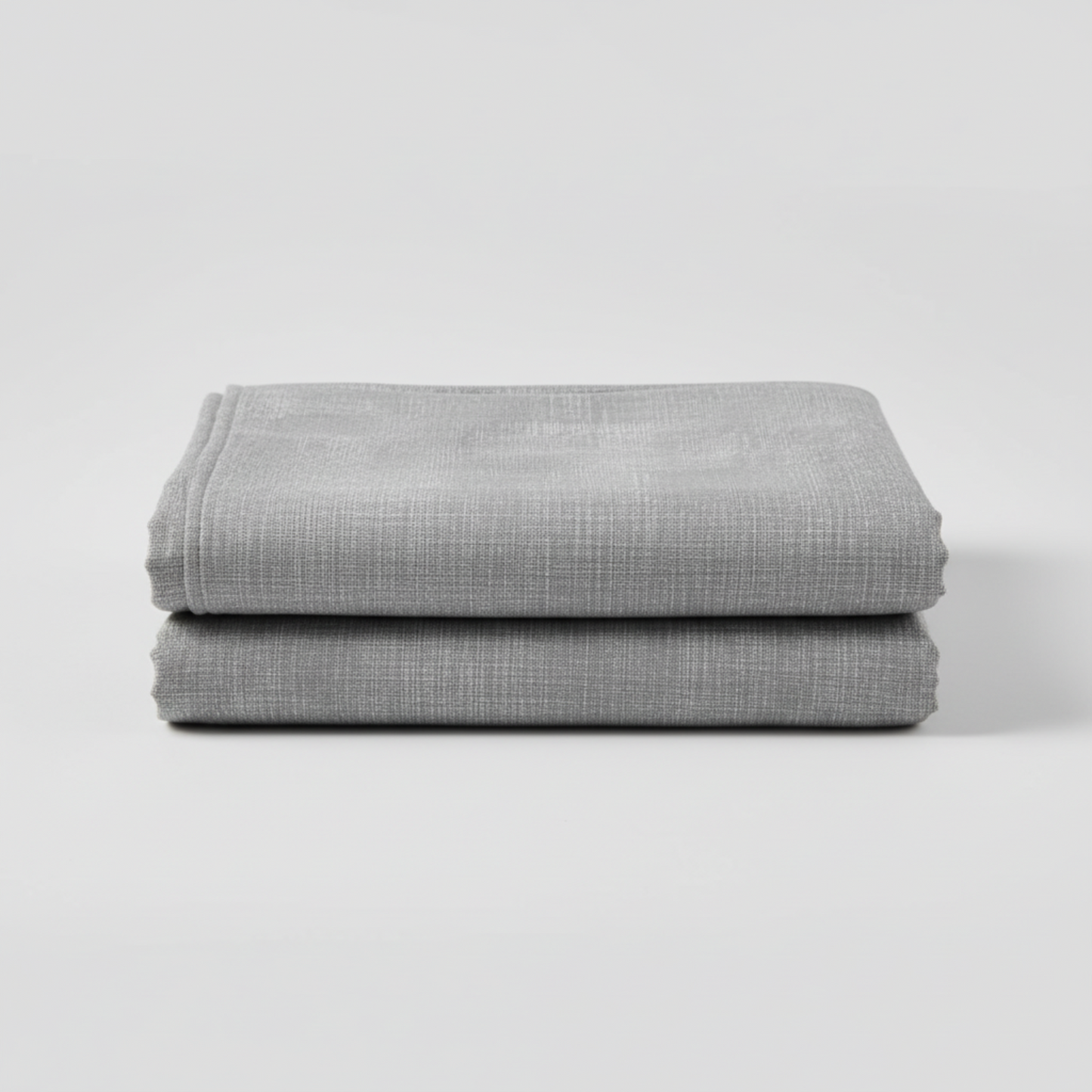Interwoven Pewter by Jason Yenter – hero shot, fabric on flat surface with soft folds, light grey background