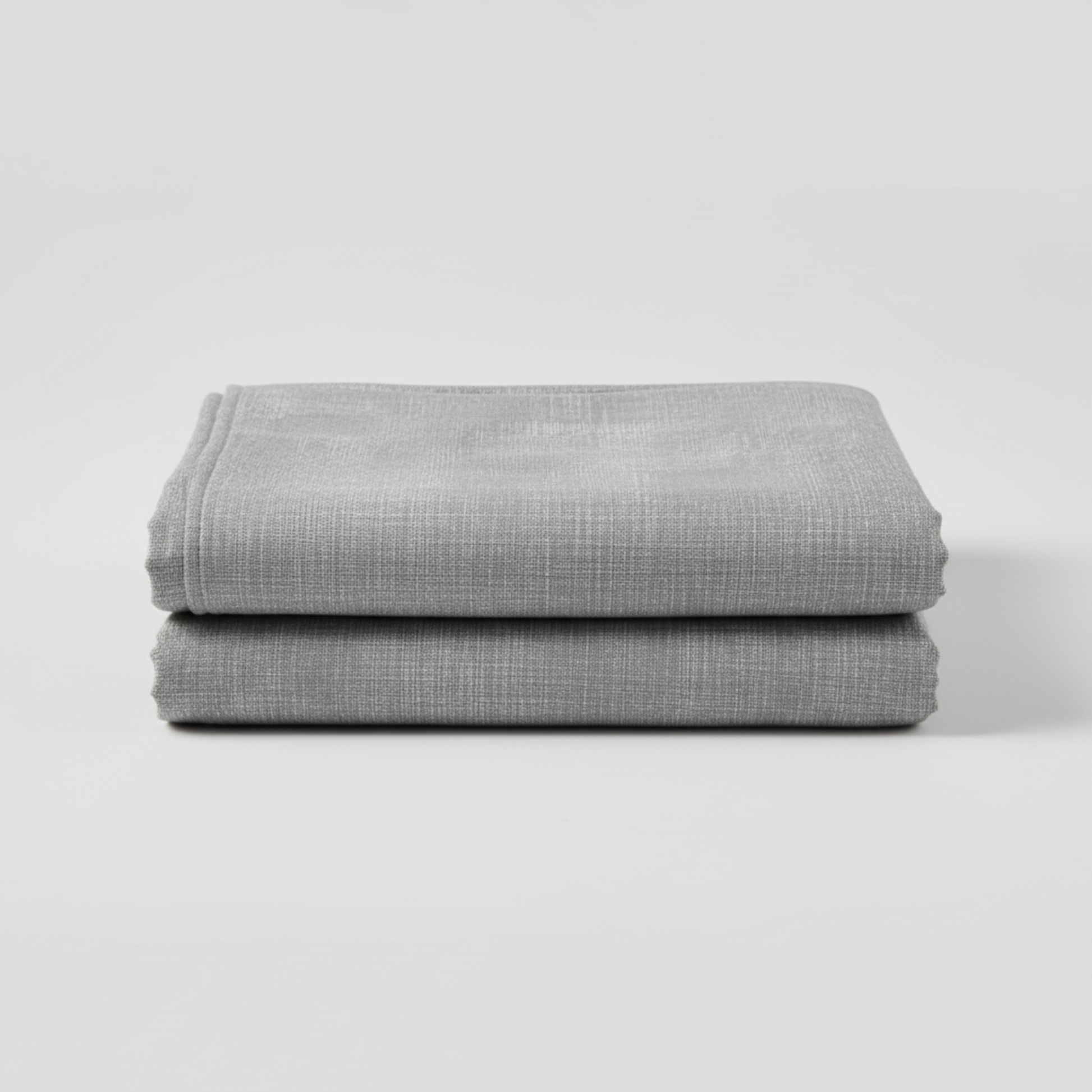 Interwoven Pewter by Jason Yenter – hero shot, fabric on flat surface with soft folds, light grey background