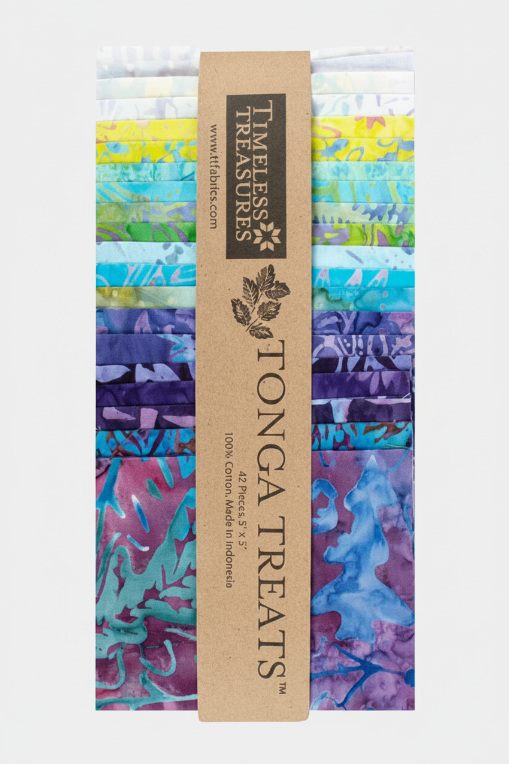 Tonga Batik Dreamer by Timeless Treasures – Tonga Treats charm pack standing upright showing 42 pre-cut 5" squares in vertical stack with full color range from white and yellow through green, aqua, teal, blue, purple, and magenta