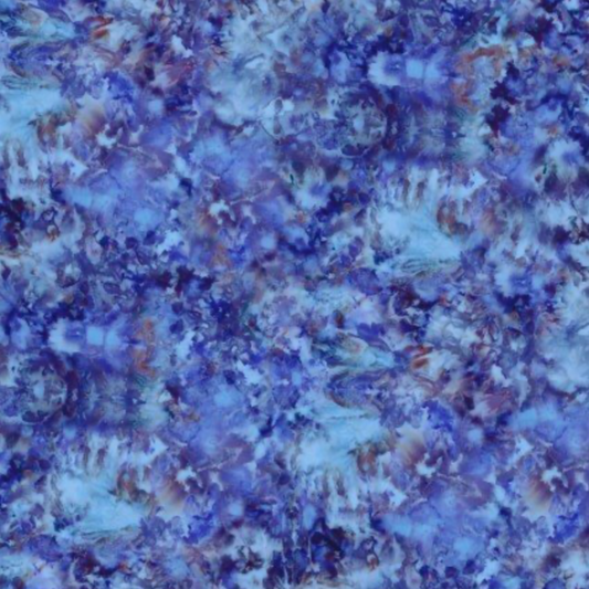 Close-up print detail of Fire & Ice by Maywood Studio Navy Ice Dye cotton quilting fabric showing blue, periwinkle, and mauve ice dye pattern