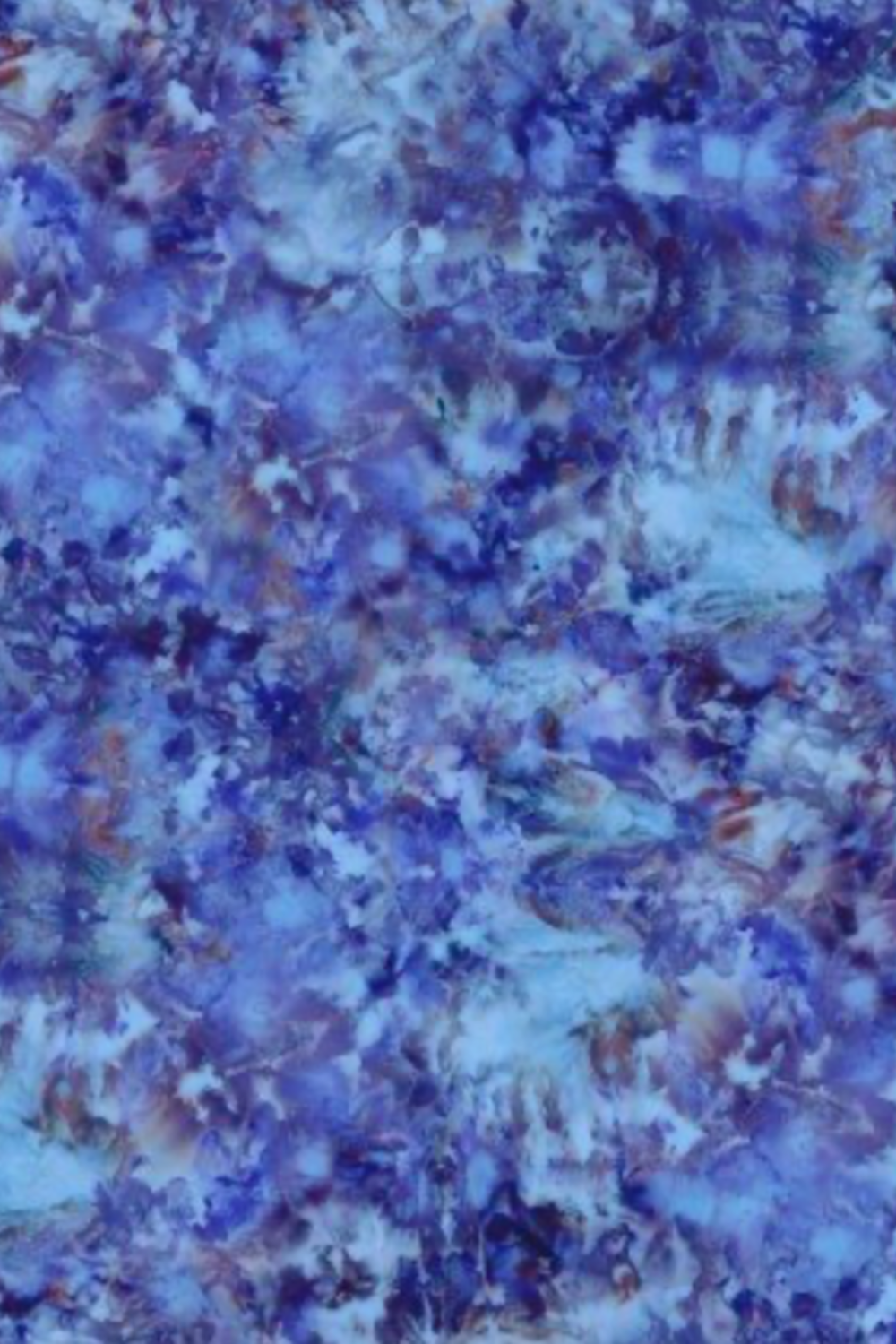 Close-up of Fire & Ice by Maywood Studio Navy Ice Dye cotton quilting fabric showing blue and purple watercolor blended tones"
