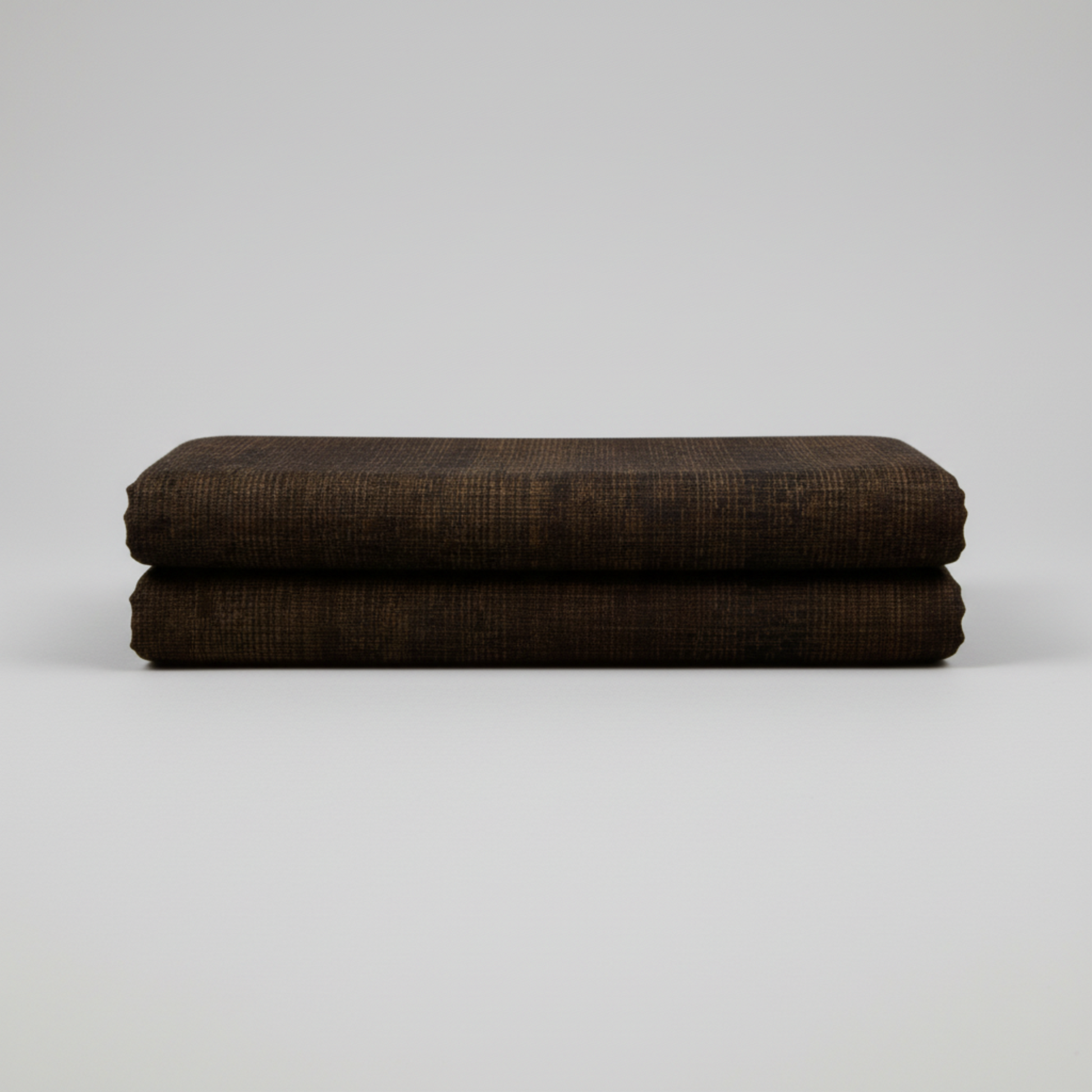 Interwoven Espresso by Jason Yenter – hero shot, fabric on flat surface with soft folds, light grey background
