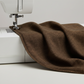 Interwoven Bark by Jason Yenter – fabric draped over the edge of a sewing machine, showing softness and body