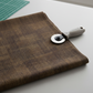 Interwoven Bark by Jason Yenter – quilt room lifestyle shot, fabric partially folded with rotary cutter on cutting mat, light grey base