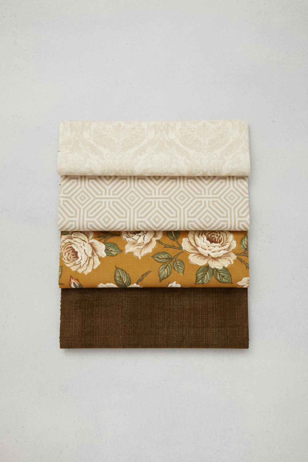 Interwoven Brown by Jason Yenter – Pinterest fabric coordination stack of 4 complementary fabrics on light grey background