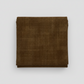 Interwoven Brown by Jason Yenter – hero shot, fabric folded on light grey background, pattern centered