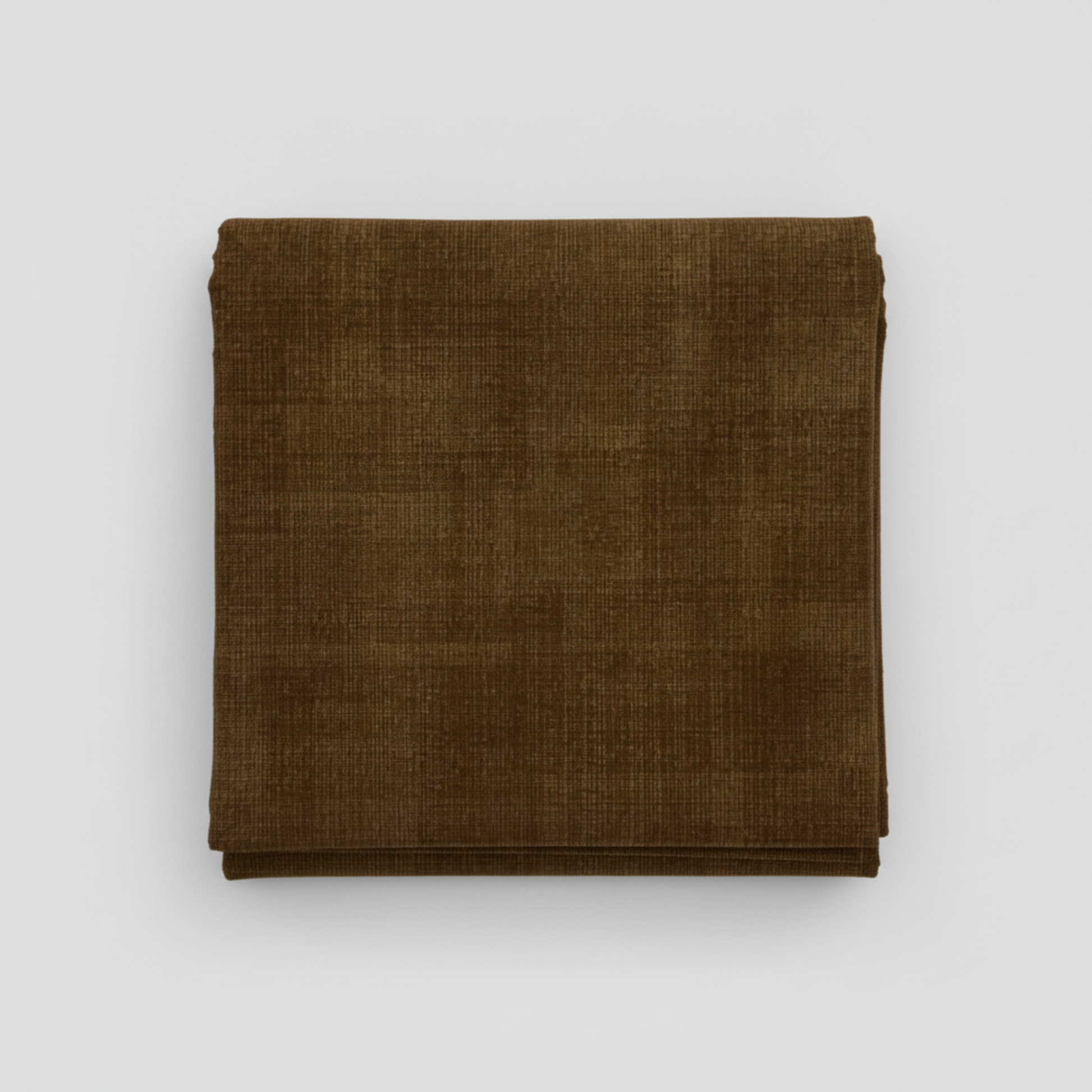 Interwoven Brown by Jason Yenter – hero shot, fabric folded on light grey background, pattern centered