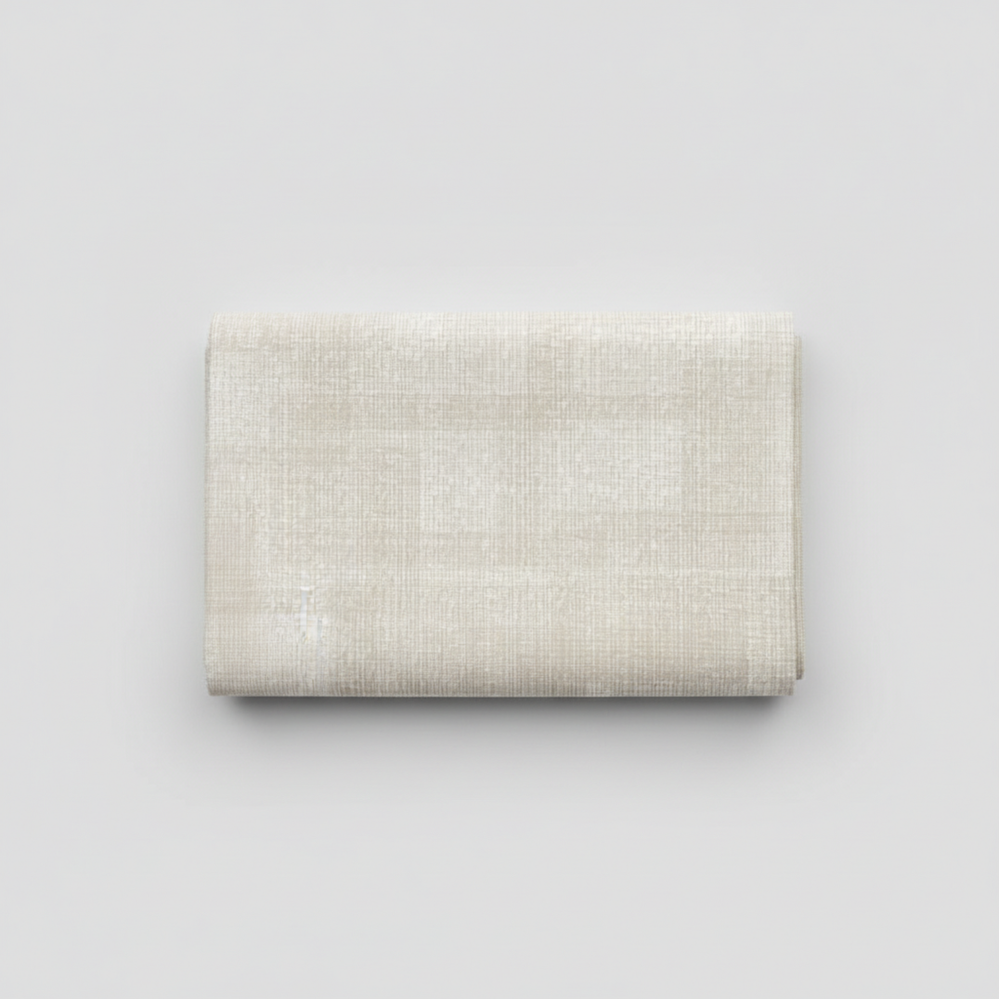 Interwoven Taupe by Jason Yenter – hero shot, fabric folded on light grey background, pattern centered
