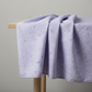 Expressions Batiks Hand-Dyed Periwinkle by Riley Blake Designs – fabric draped over a table edge, showing softness and drape