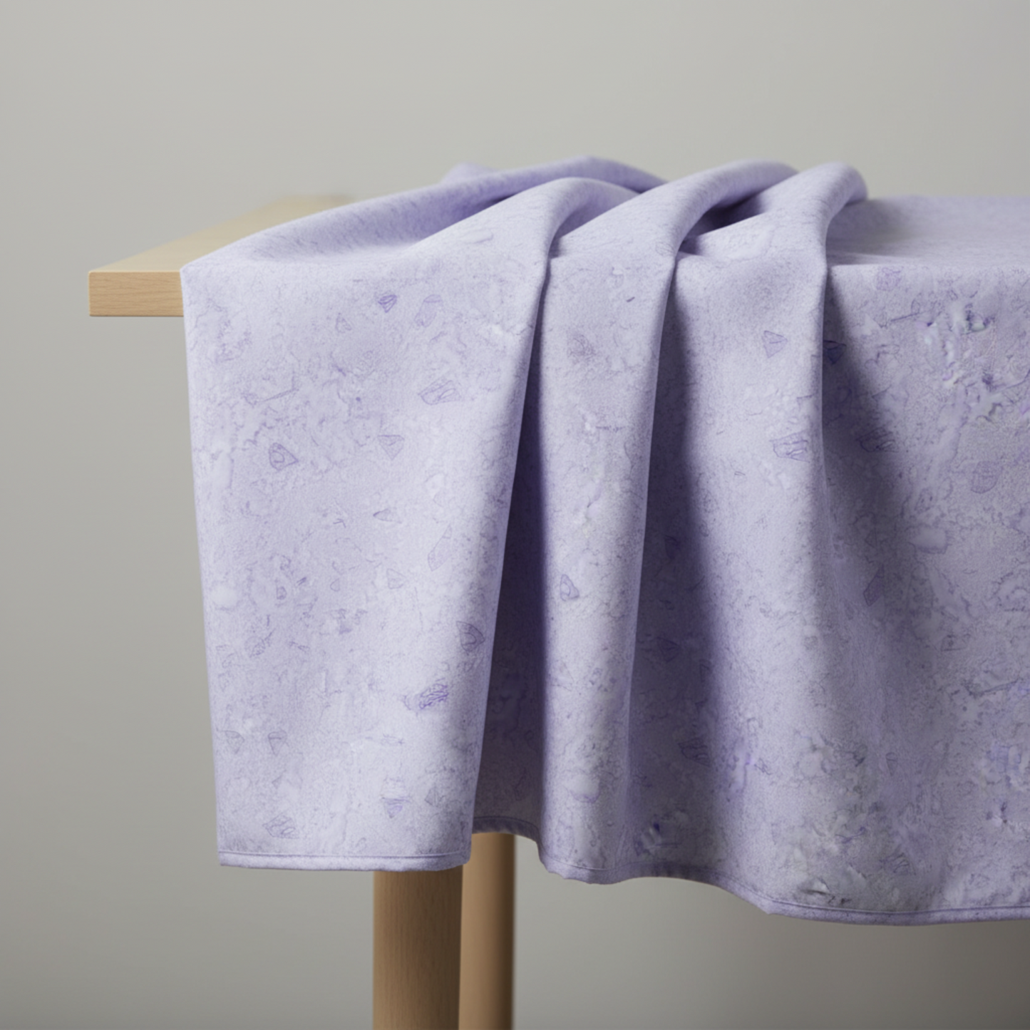 Expressions Batiks Hand-Dyed Periwinkle by Riley Blake Designs – fabric draped over a table edge, showing softness and drape