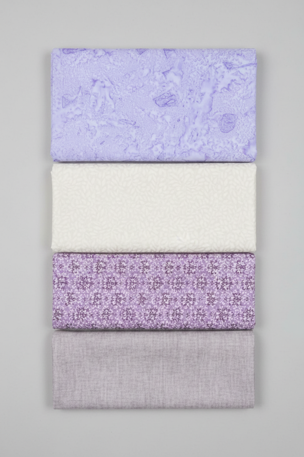Expressions Batiks Hand-Dyed Periwinkle by Riley Blake Designs – Pinterest coordination stack of 4 complementary fabrics on light grey background