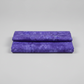 Expressions Batiks Hand-Dyed Purple II – hero flat lay, rich purple hand-dyed batik quilting cotton centered on light grey background, Riley Blake Designs