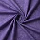 Expressions Batiks Hand-Dyed Purple II – fabric laying flat with hurricane funnel twist fold in the center