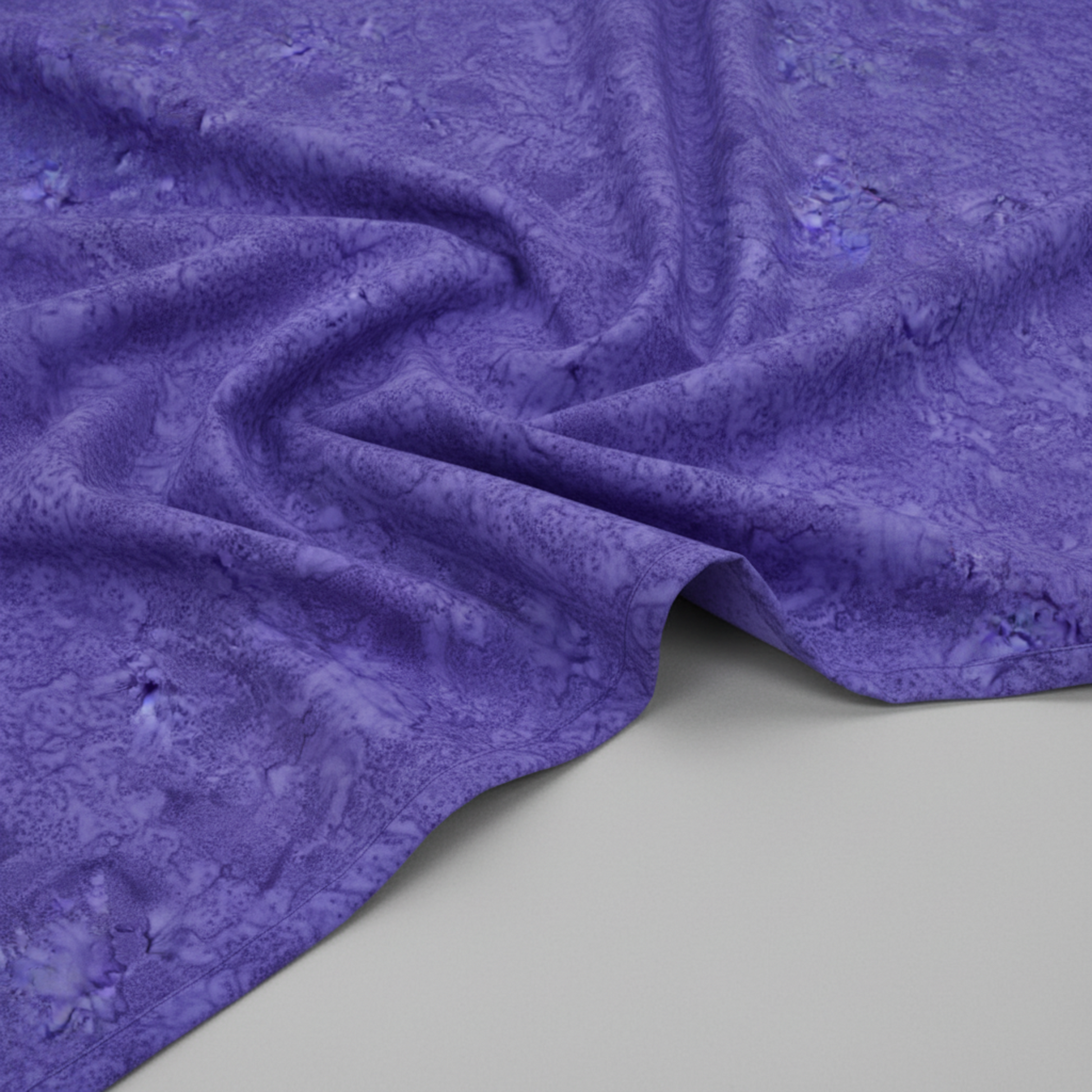 Expressions Batiks Hand-Dyed Purple II – fabric laying flat on surface showing full drape and rich purple hand-dyed batik pattern