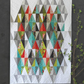 Harlequin quilt pattern by Robin Pickens – Layer Cake friendly design using Half-Rectangle Triangles, two sizes available – Shop at IraRobi Quilts