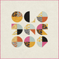 Spotlight quilt pattern layout — nine bold circle blocks in warm orange, pink, aqua, and black on cream background, curves and half-square triangles design by Brigitte Heitland
