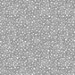 Essentials Connect The Dots Gray quilting cotton by Susan Winget for Wilmington Prints — close-up of warm grey ground with tossed soft white scattered dots in varying sizes, a versatile low-volume blender fabric for quilts and sewing projects