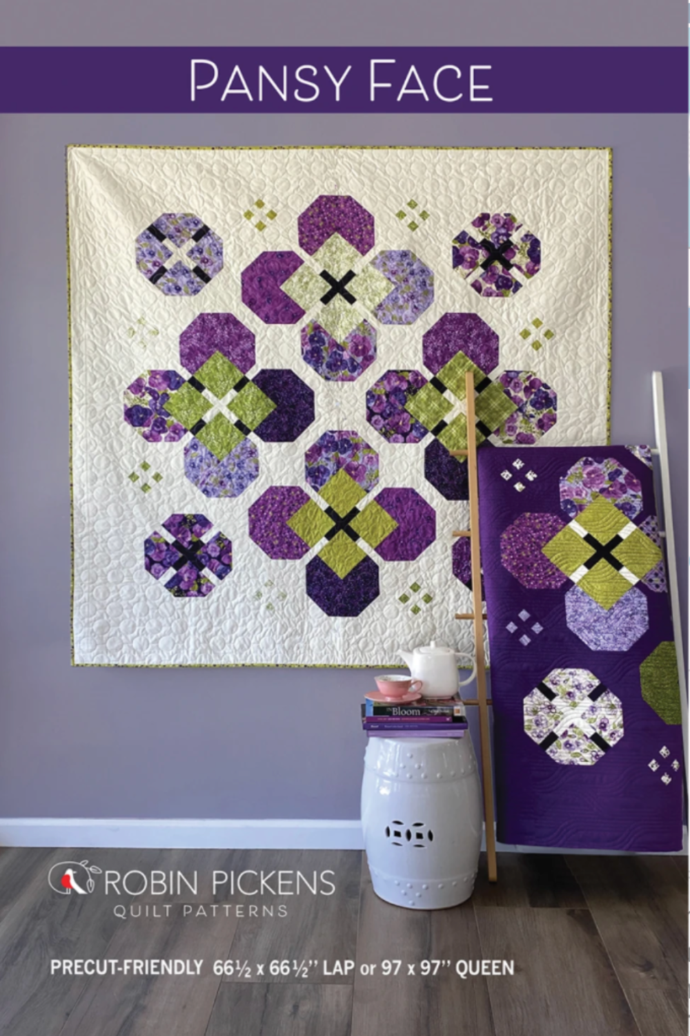 Bold pansy blooms set on point in purple & green! Pansy Face by Robin Pickens — lap or queen size, Layer Cake & Charm Pack friendly. Shop at IraRobi Quilts! #QuiltPattern #RobinPickens #FloralQuilt