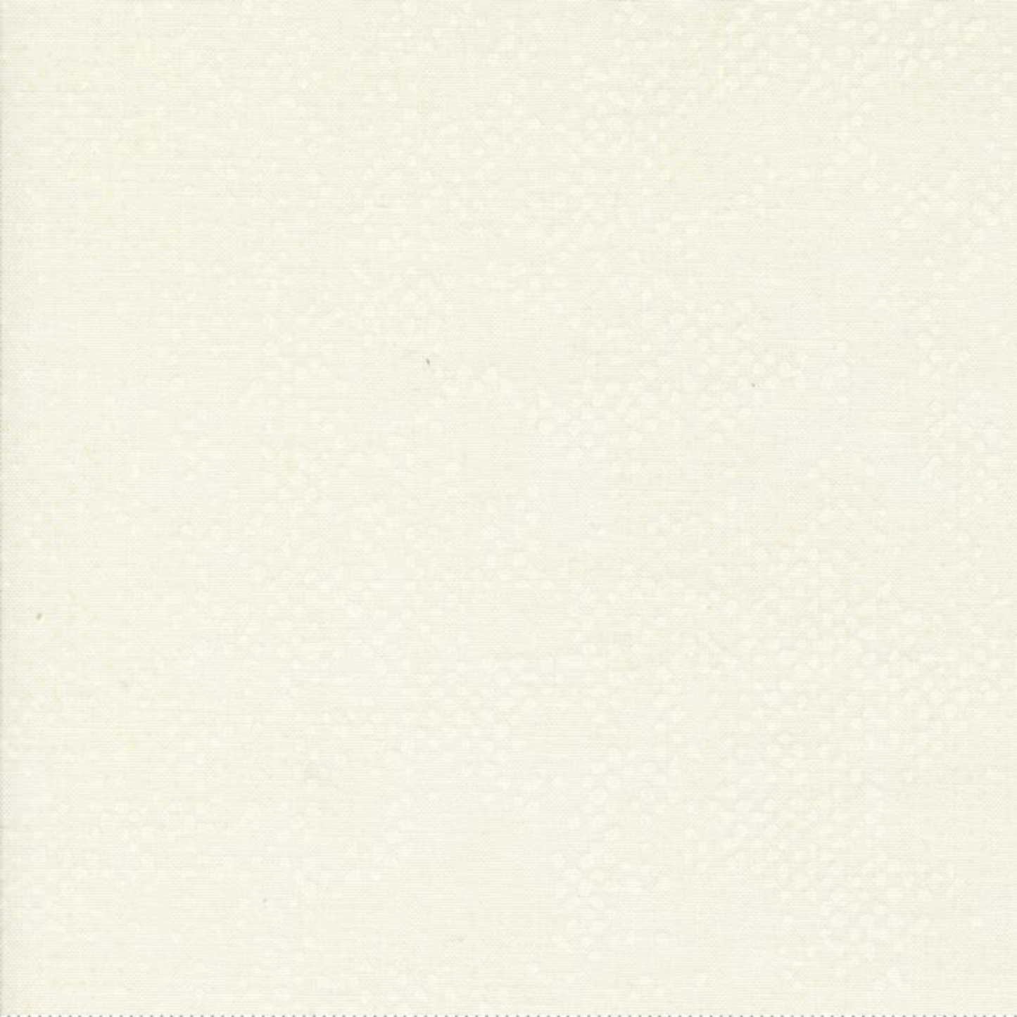 Spotted Ivory quilting cotton fabric folded to show texture – soft warm ivory tonal speckled blender by Zen Chic for Moda Fabrics, 100% cotton