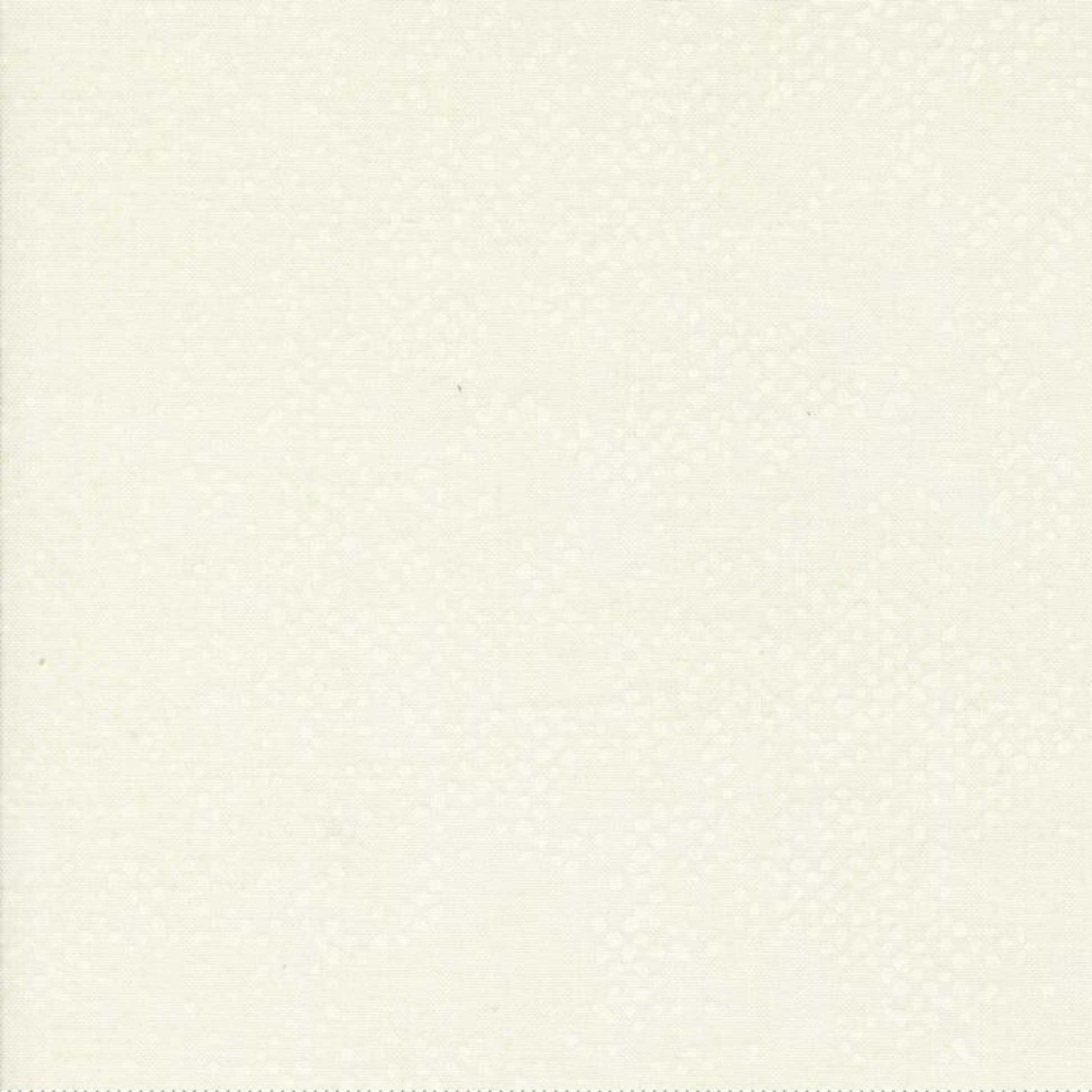 Spotted Ivory quilting cotton fabric folded to show texture – soft warm ivory tonal speckled blender by Zen Chic for Moda Fabrics, 100% cotton