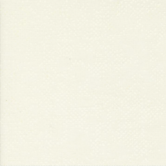 Spotted Ivory quilting cotton fabric folded to show texture – soft warm ivory tonal speckled blender by Zen Chic for Moda Fabrics, 100% cotton