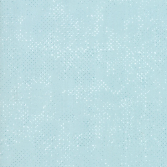 Spotted Mist quilting cotton fabric by Zen Chic for Moda Fabrics showing soft pale icy aqua-blue ground with subtle tonal speckled texture – a delicate near-solid blender, 100% cotton, 43–44" wide