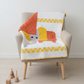 Playful handmade elephant baby quilt in soft yellow, gray, and orange tones