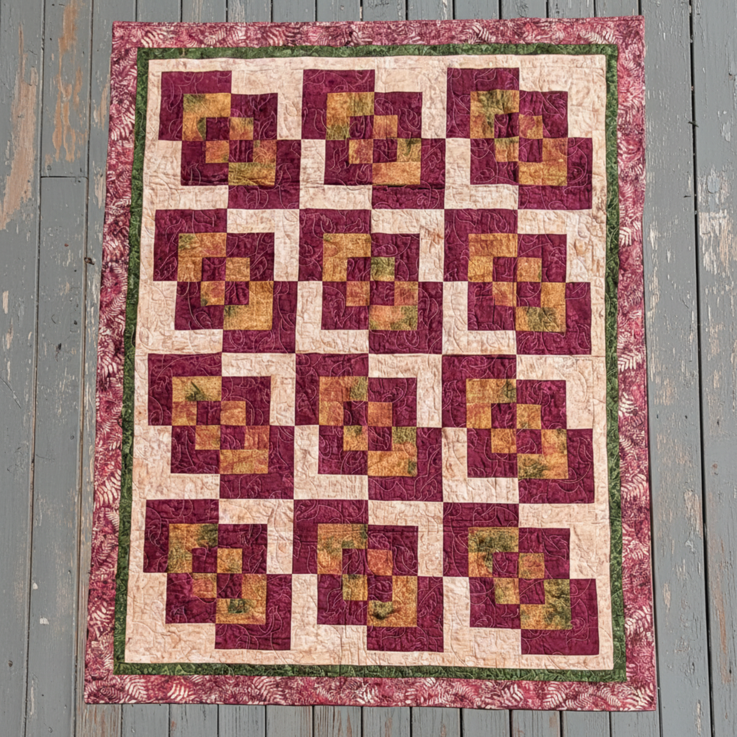Corner Play handmade quilt with bold geometric blocks laid flat outdoors