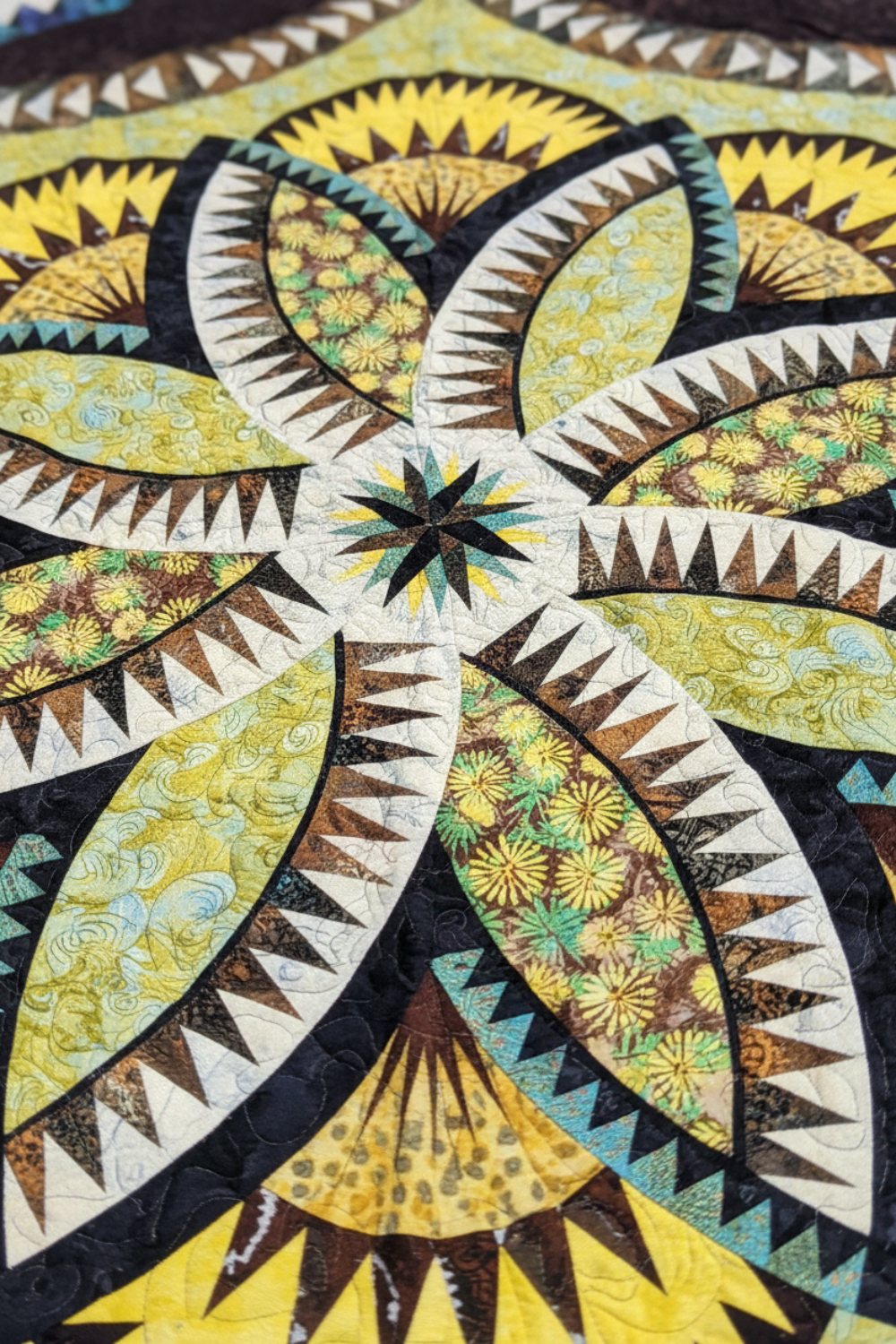 Close-up of Lily Pond Hosta quilt highlighting paper-pieced floral medallion and precision points