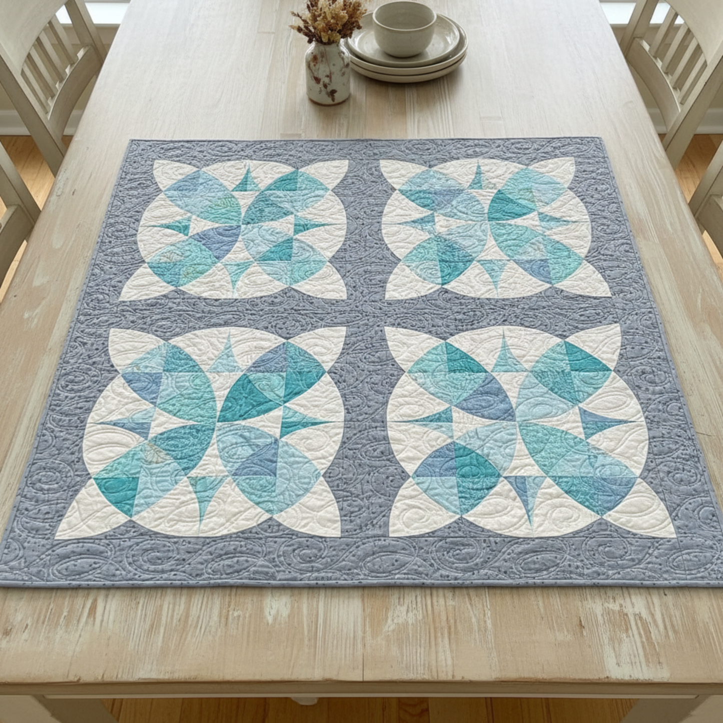Quilt with butterfly pattern on a wooden table