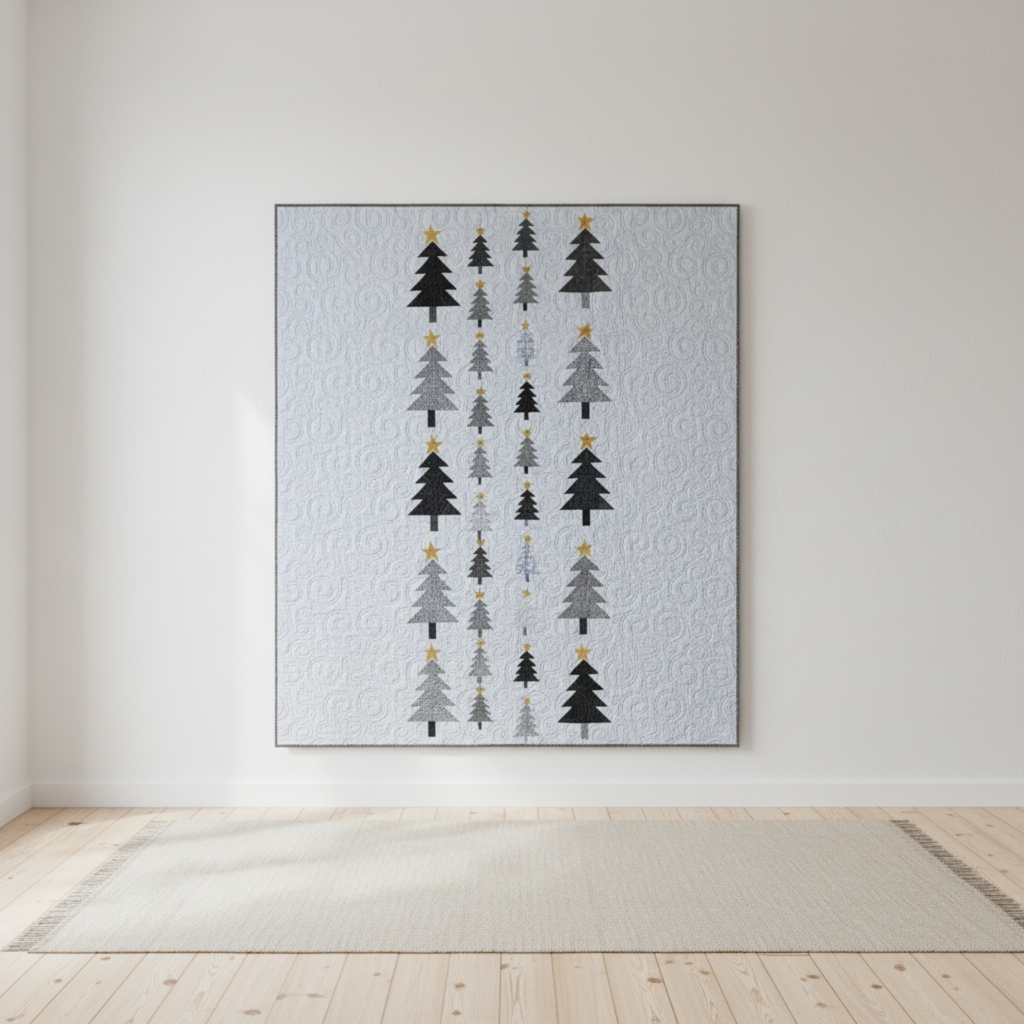 Modern handmade winter quilt with gray and black tree motifs and gold stars on a white background, 56 x 67 inches