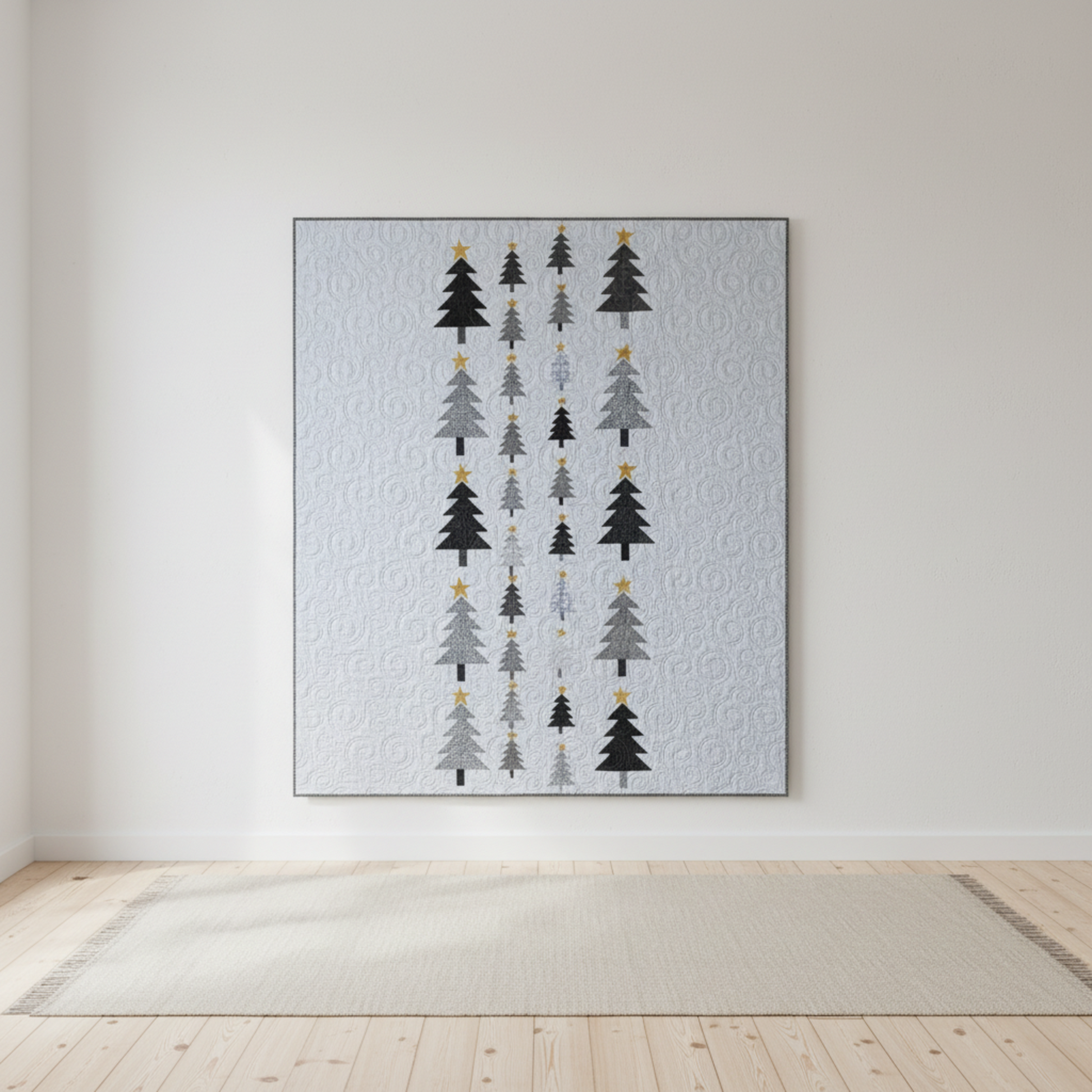 Modern handmade winter quilt with gray and black tree motifs and gold stars on a white background, 56 x 67 inches