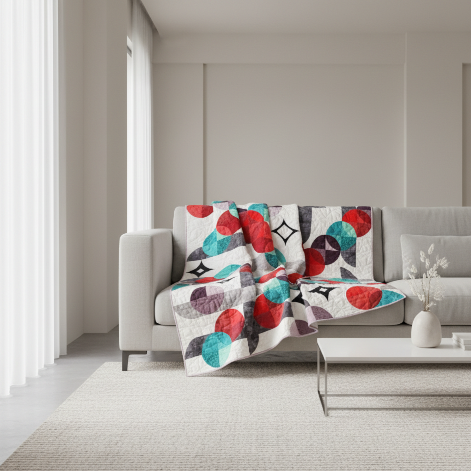 Modern Moon Dance quilt draped over sofa showing movement and scale