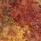 Close-up of Windsong Tonga Batiks Floral Medallions Sienna fabric by Wing and a Prayer Design for Timeless Treasures, with layered floral and leafy motifs in warm earth tones.