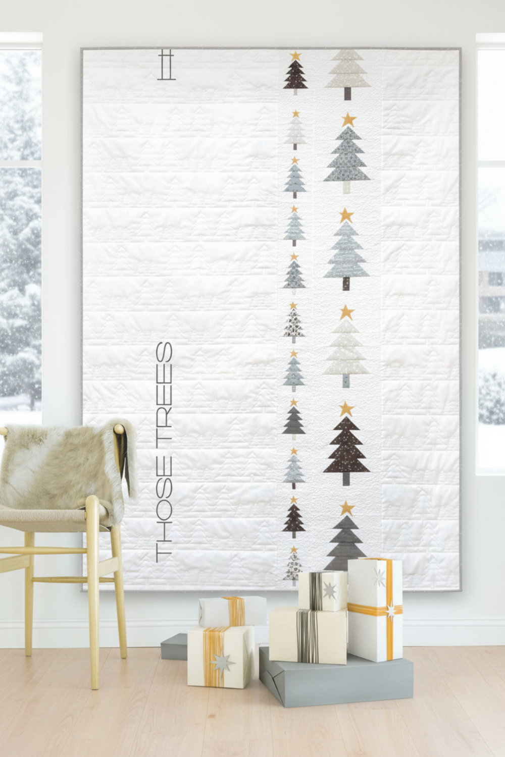 Decorative wall art with Christmas tree designs and presents on a white brick wall.